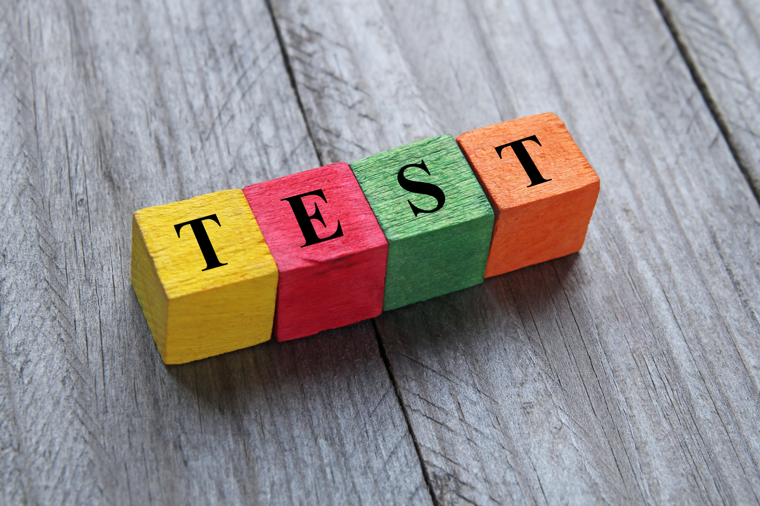 word test on colorful wooden cubes